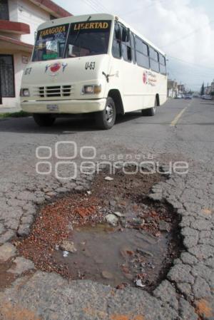 DAÑO A CARPETA ASFALTICA - BACHES