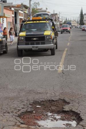 DAÑO A CARPETA ASFALTICA - BACHES