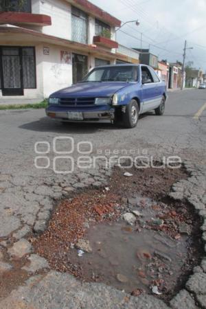 DAÑO A CARPETA ASFALTICA - BACHES