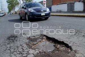 DAÑO A CARPETA ASFALTICA - BACHES