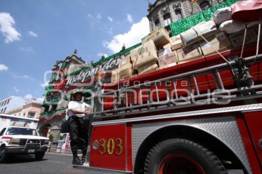 DESFILE DE BOMBEROS CON VÍVERES PARA DAMNIFICADOS