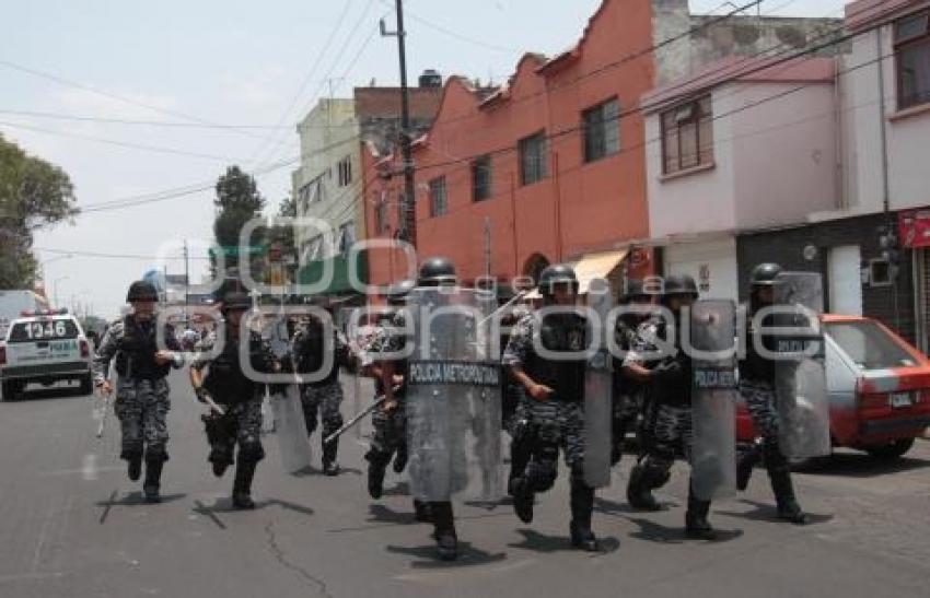 ENFRENTAMIENTO - COMERCIANTES - POLICIA