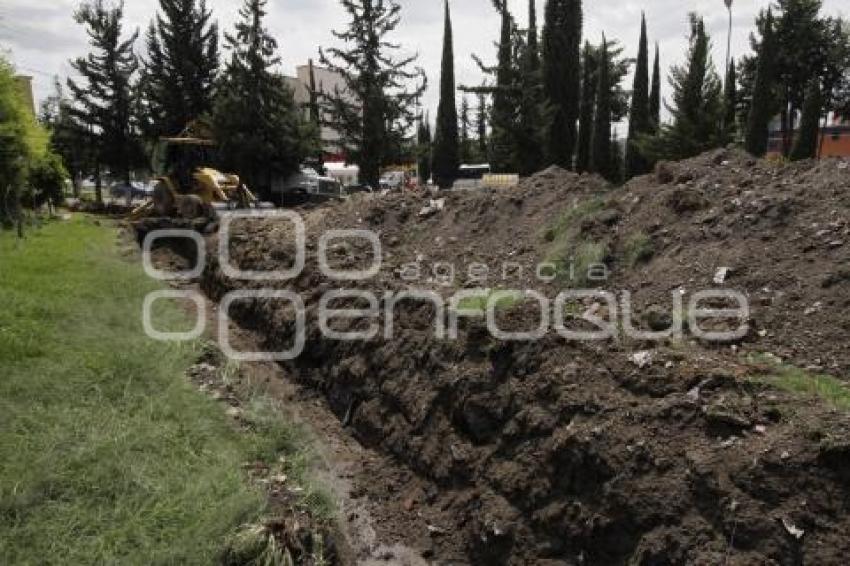 CONSTRUYEN CANAL DE DESFOGUE EN CRUCERO DE MARGARITAS Y NACIONAL