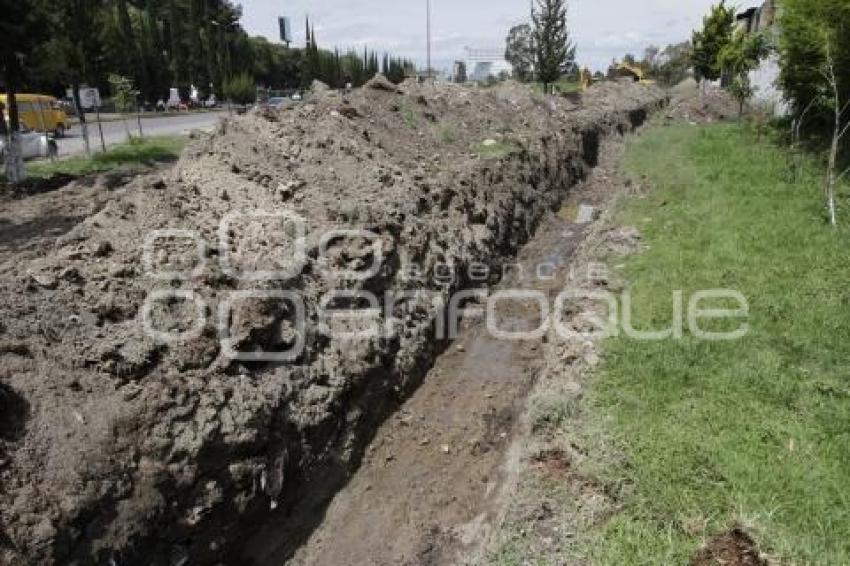 CONSTRUYEN CANAL DE DESFOGUE EN CRUCERO DE MARGARITAS Y NACIONAL