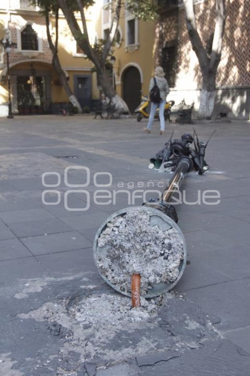 CAE LÁMPARA EN EL CENTRO