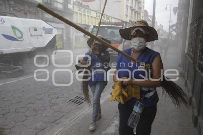 SERVICIO DE LIMPIA AL TÉRMINO DE LA PROCESIÓN . VIERNES SANTO