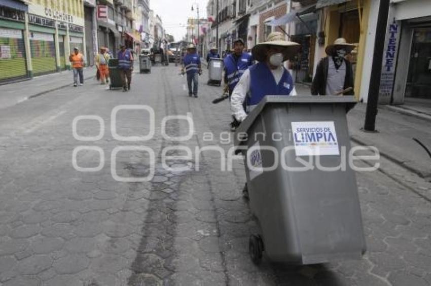 SERVICIO DE LIMPIA AL TÉRMINO DE LA PROCESIÓN . VIERNES SANTO