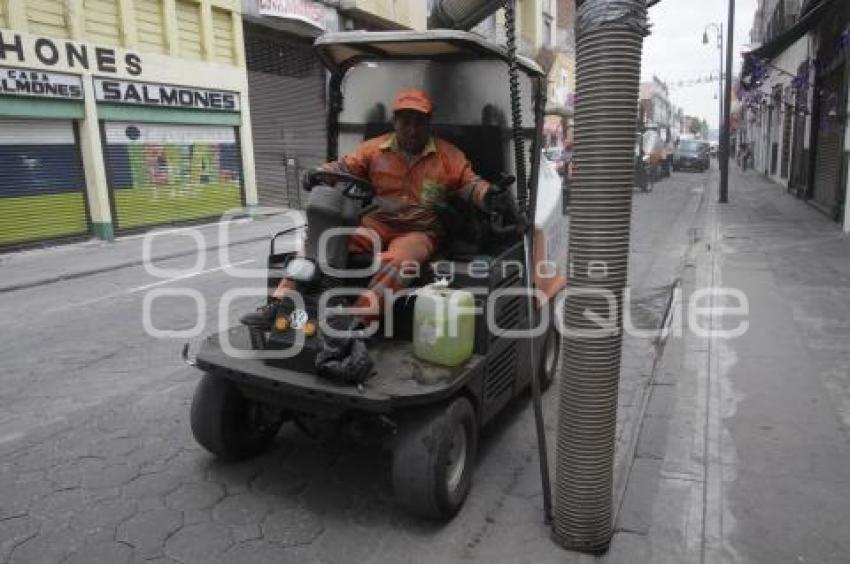 SERVICIO DE LIMPIA AL TÉRMINO DE LA PROCESIÓN . VIERNES SANTO