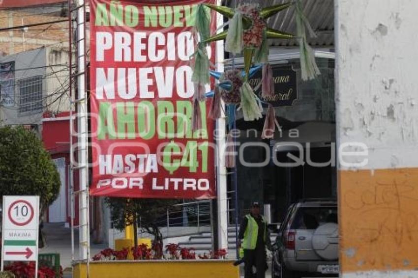 GASOLINA . REDUCCIÓN DE PRECIO