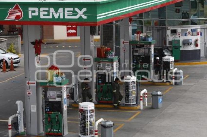GASOLINA . REDUCCIÓN DE PRECIO