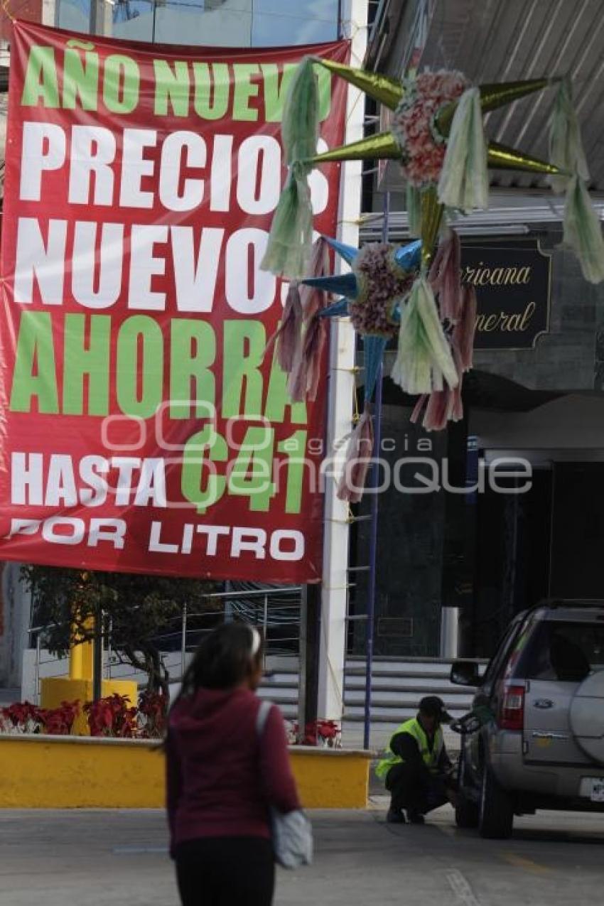 GASOLINA . REDUCCIÓN DE PRECIO