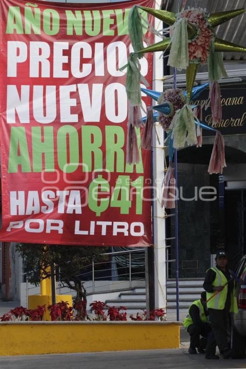 GASOLINA . REDUCCIÓN DE PRECIO