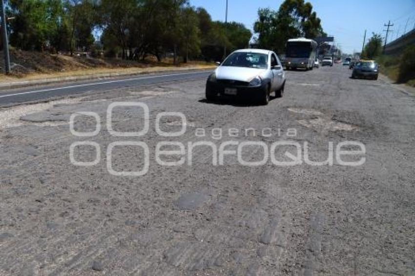 BAJO PUENTE . SEGUNDO PISO AUTOPISTA