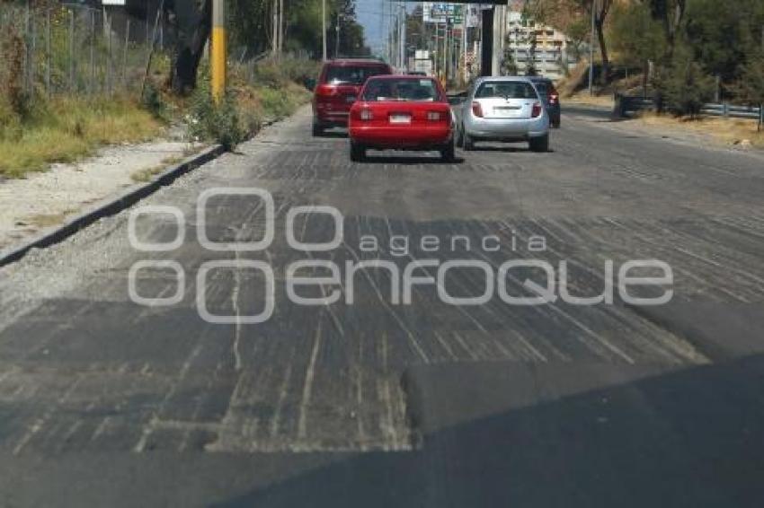 BAJO PUENTE . SEGUNDO PISO AUTOPISTA