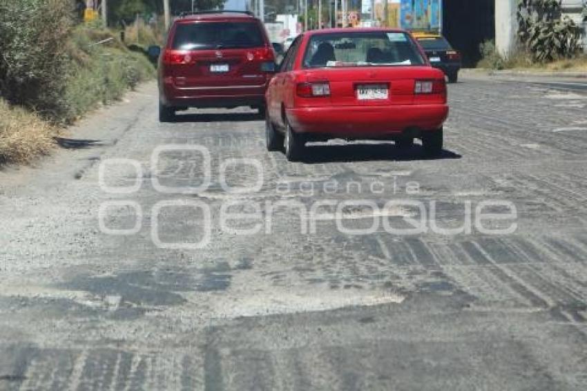 BAJO PUENTE . SEGUNDO PISO AUTOPISTA