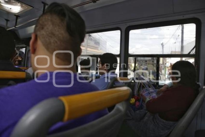 TRANSPORTE PÚBLICO . VIDRIOS POLARIZADOS