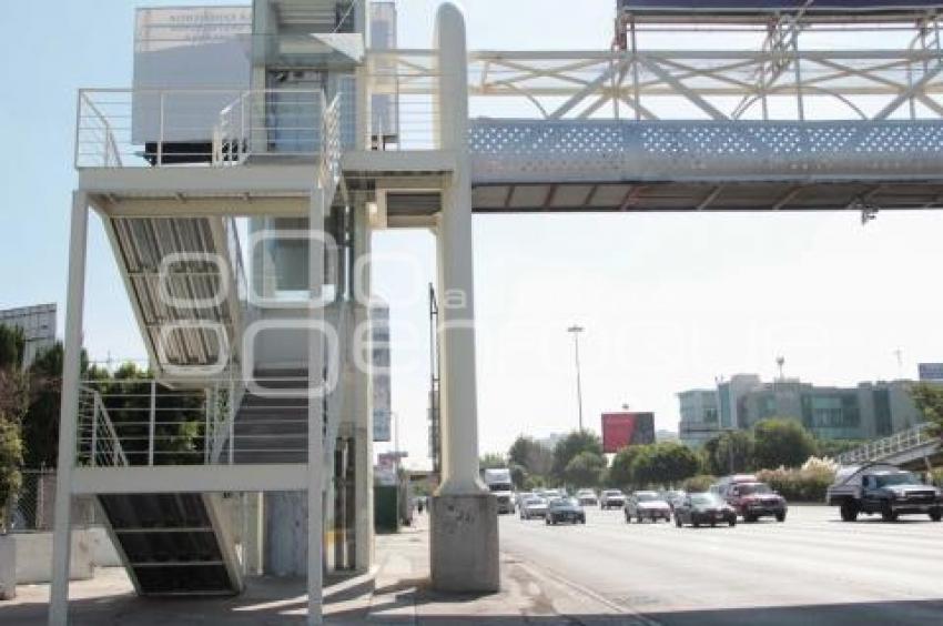 ELEVADOR . PUENTE PEATONAL