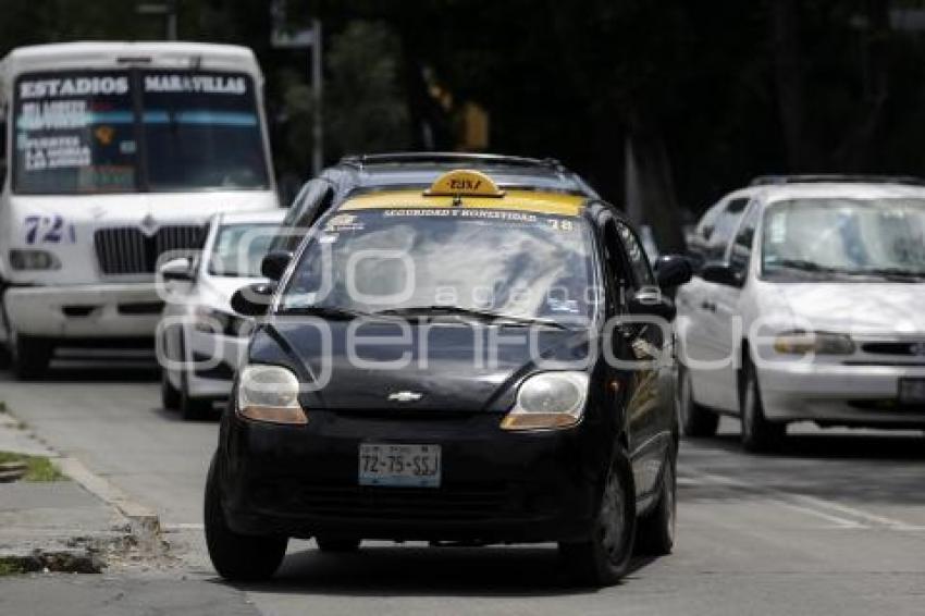 TRANSPORTE . TAXIS