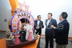 EXPOSICIÓN . DE MUERTOS Y JOLGORIOS