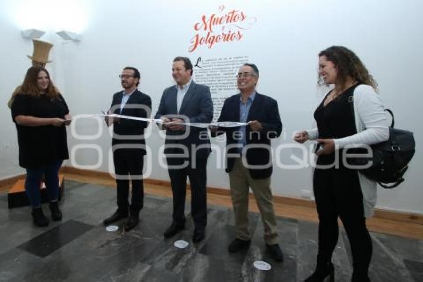 EXPOSICIÓN . DE MUERTOS Y JOLGORIOS