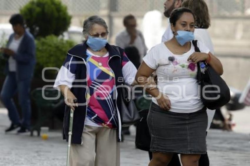 CONTAMINACIÓN AMBIENTAL . CUBREBOCAS