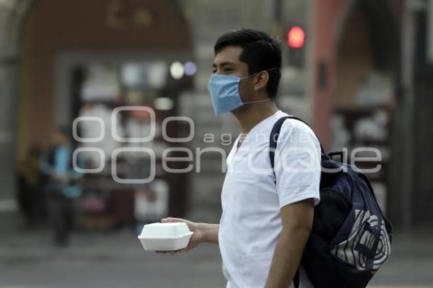 CONTAMINACIÓN AMBIENTAL . CUBREBOCAS