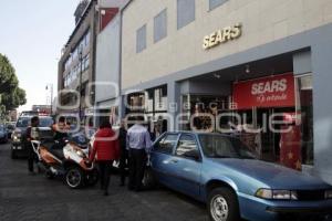 CAÍDA MUJER TIENDA DEPARTAMENTAL