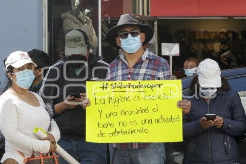 MANIFESTACIÓN . BAÑOS PÚBLICOS