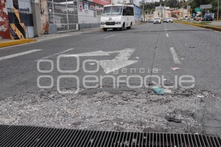 BACHE EN REJILLA DE ALCANTARILLA