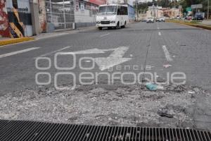 BACHE EN REJILLA DE ALCANTARILLA