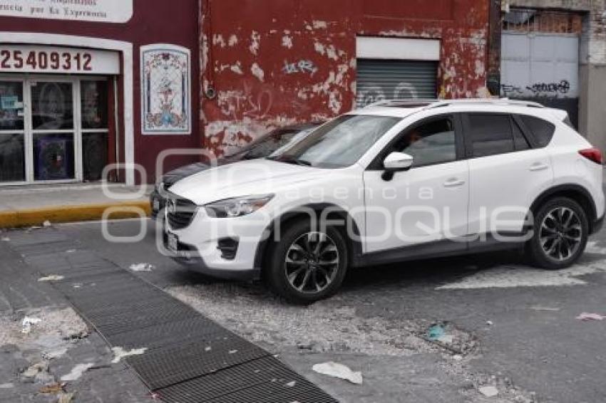 BACHE EN REJILLA DE ALCANTARILLA