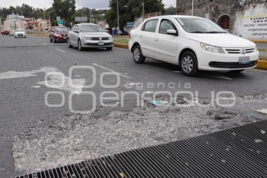 BACHE EN REJILLA DE ALCANTARILLA