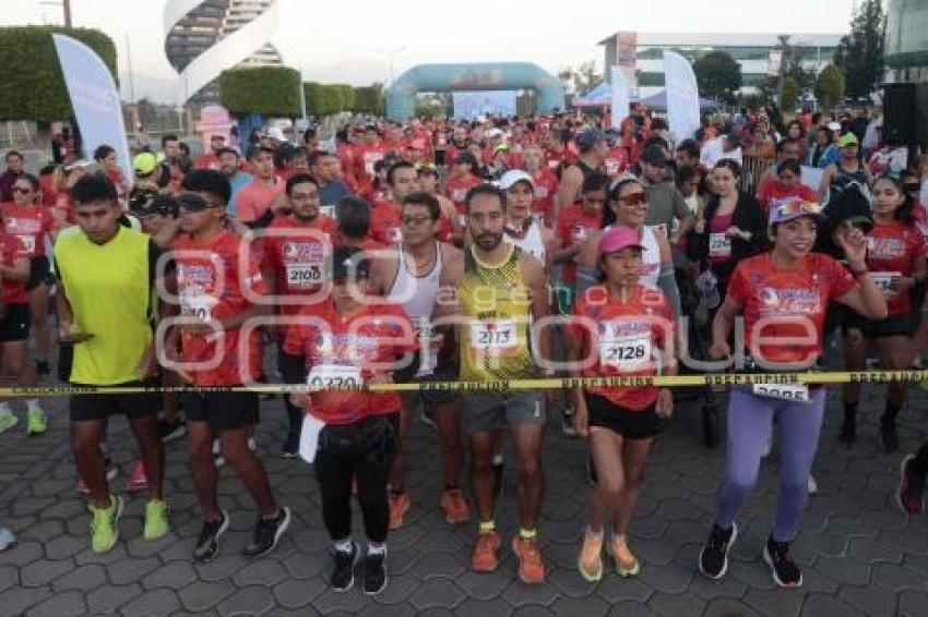 CARRERA POR LA MUJER