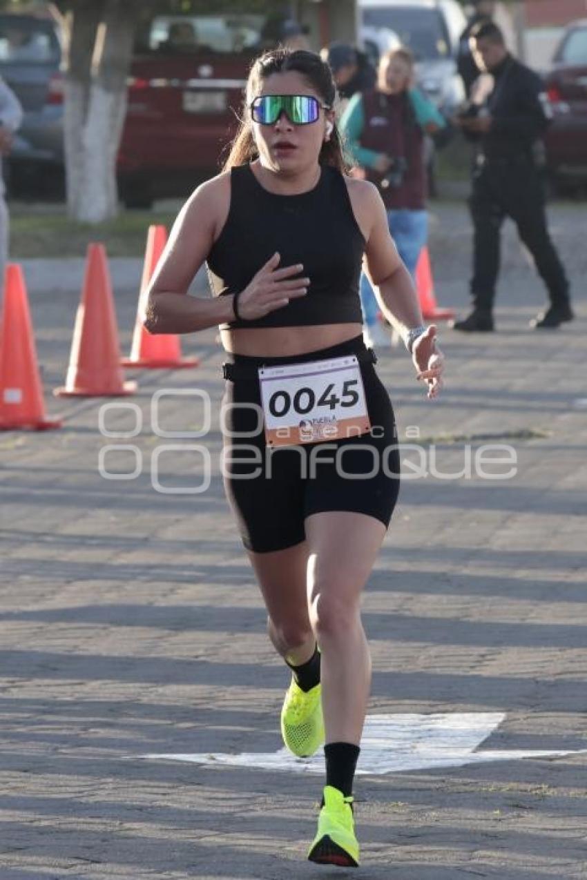 CARRERA POR LA MUJER